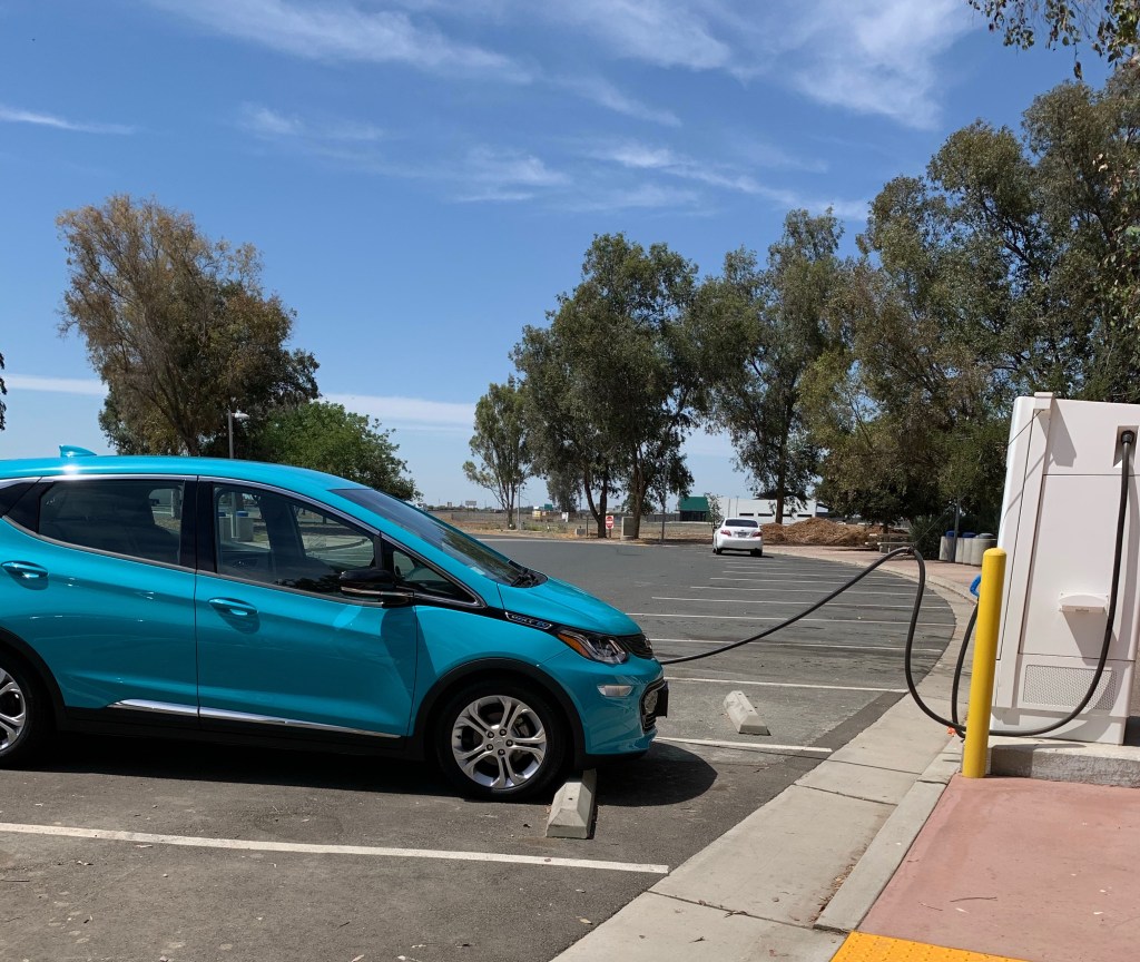 Blue Bolt plugged into a charger