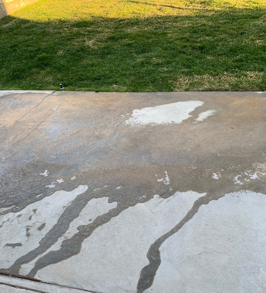 Concrete patio half covered in ice