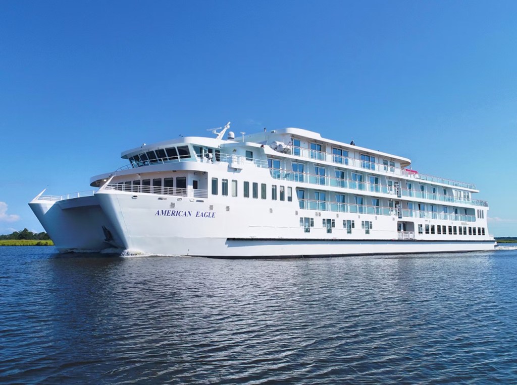 The American Eagle sailing down a river. 